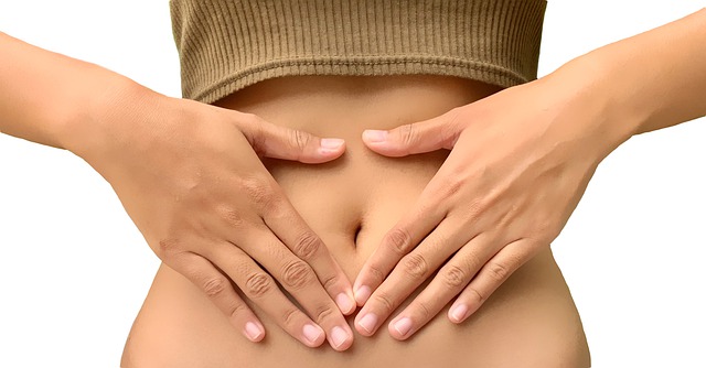Healthy gut hands on stomach
