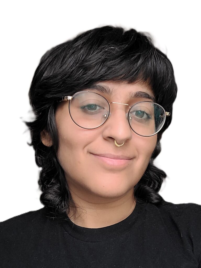 Photo of Gunjan Chopra, wearing a black shirt with glasses