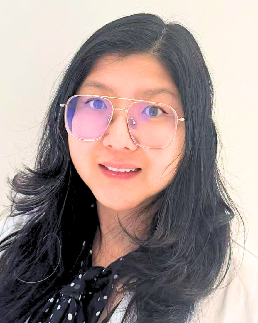 Photo of Jane Juan Zhu in a white coat with glasses