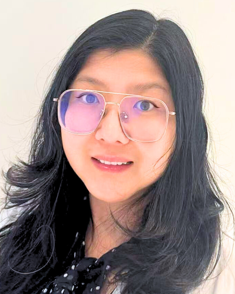 Photo of Jane Juan Zhu in a white coat with glasses